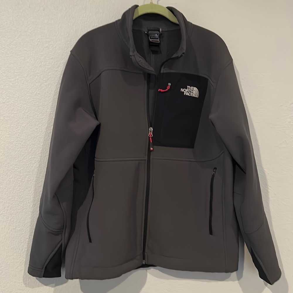 The North Face Men’s gray jacket, size medium.
